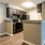a kitchen with black cabinets