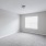 Bedroom with carpet and large window