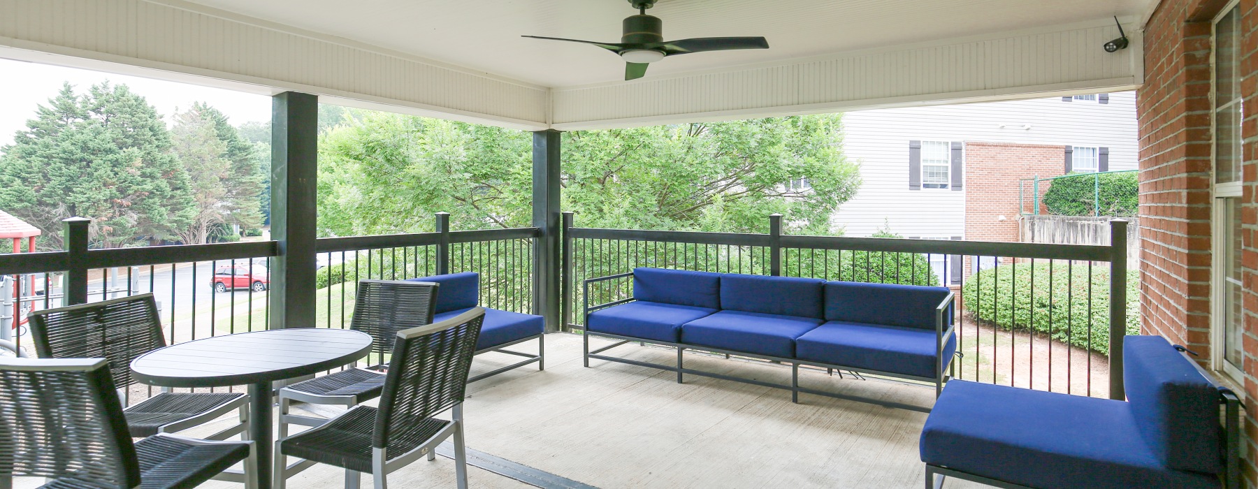 Large porch with furniture and ceiling fan
